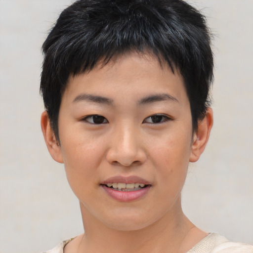 Joyful asian young-adult female with short  brown hair and brown eyes