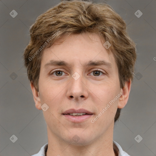 Joyful white adult male with short  brown hair and grey eyes