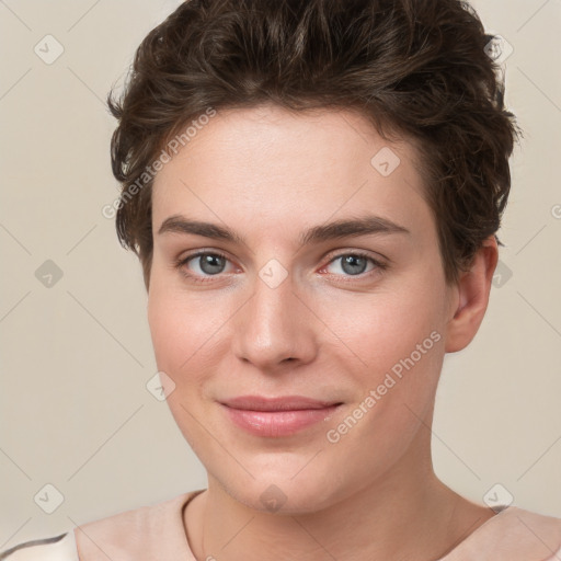 Joyful white young-adult female with short  brown hair and grey eyes