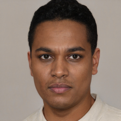 Neutral latino young-adult male with short  black hair and brown eyes