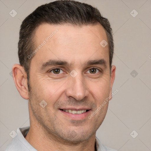 Joyful white adult male with short  brown hair and brown eyes