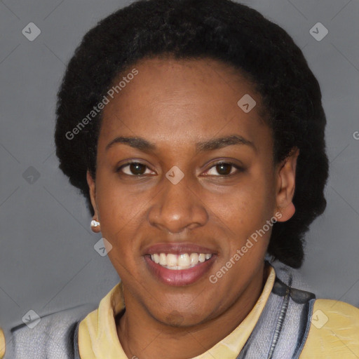 Joyful black young-adult female with short  black hair and brown eyes