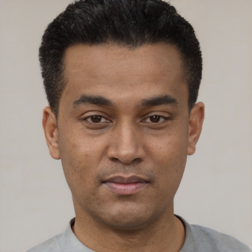 Neutral latino young-adult male with short  black hair and brown eyes