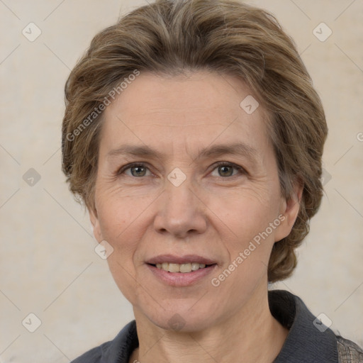 Joyful white adult female with medium  brown hair and grey eyes