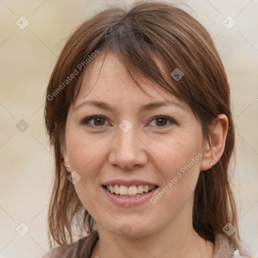 Joyful white adult female with medium  brown hair and brown eyes