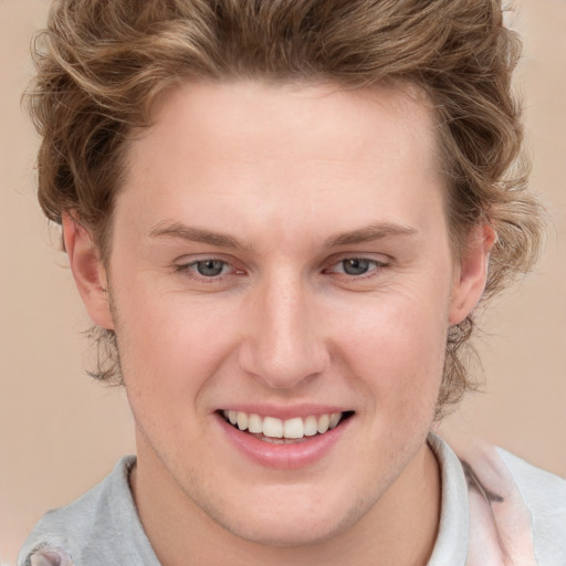 Joyful white young-adult female with short  brown hair and blue eyes