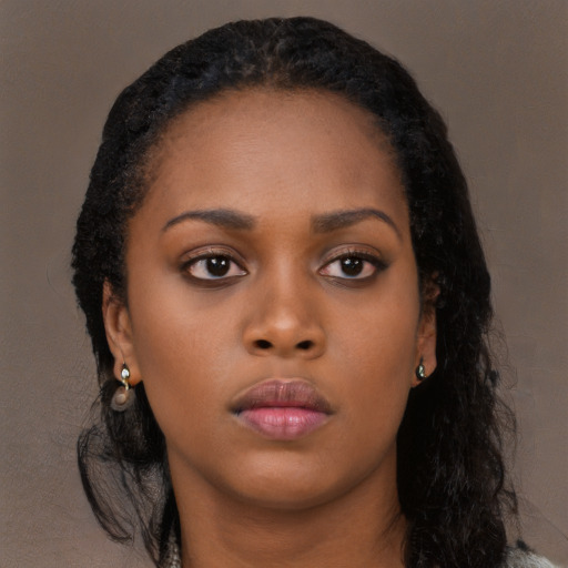 Neutral black young-adult female with long  black hair and brown eyes