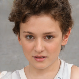 Joyful white child female with short  brown hair and brown eyes