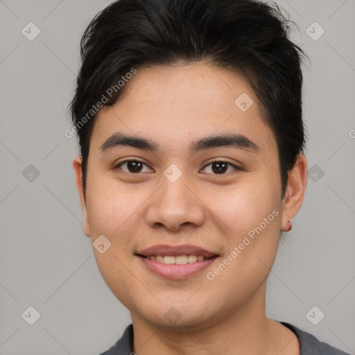 Joyful asian young-adult male with short  brown hair and brown eyes