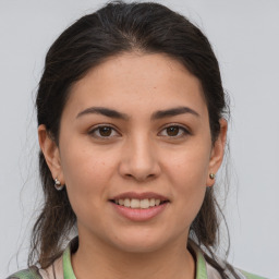 Joyful white young-adult female with medium  brown hair and brown eyes