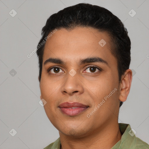 Joyful latino young-adult male with short  black hair and brown eyes