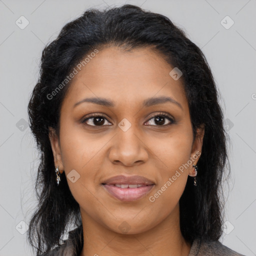 Joyful black young-adult female with long  brown hair and brown eyes