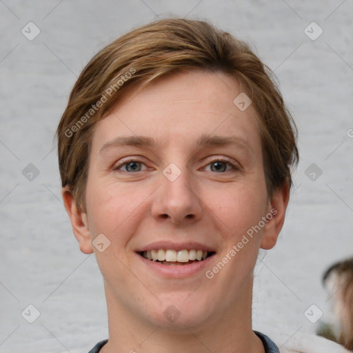 Joyful white young-adult female with short  brown hair and grey eyes