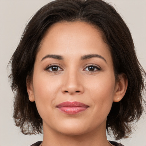 Joyful white young-adult female with medium  brown hair and brown eyes