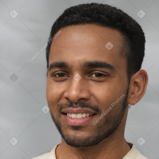 Joyful black young-adult male with short  black hair and brown eyes