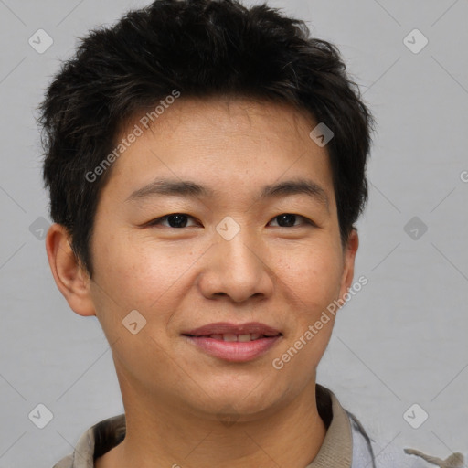 Joyful asian young-adult male with short  brown hair and brown eyes