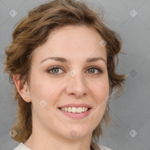 Joyful white young-adult female with medium  brown hair and green eyes