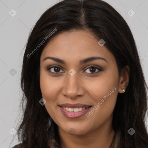 Joyful latino young-adult female with long  brown hair and brown eyes