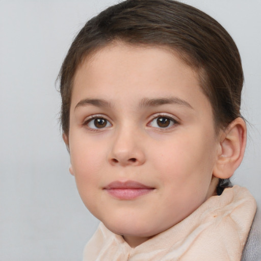 Joyful white child female with short  brown hair and brown eyes