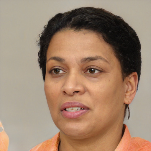 Joyful white adult female with short  brown hair and brown eyes