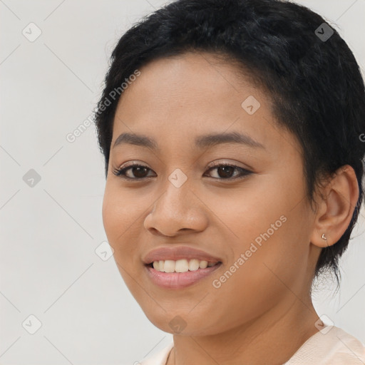 Joyful latino young-adult female with short  black hair and brown eyes