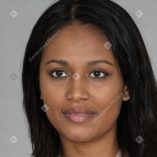 Joyful black young-adult female with long  brown hair and brown eyes