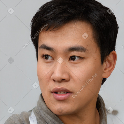 Neutral asian young-adult male with short  black hair and brown eyes