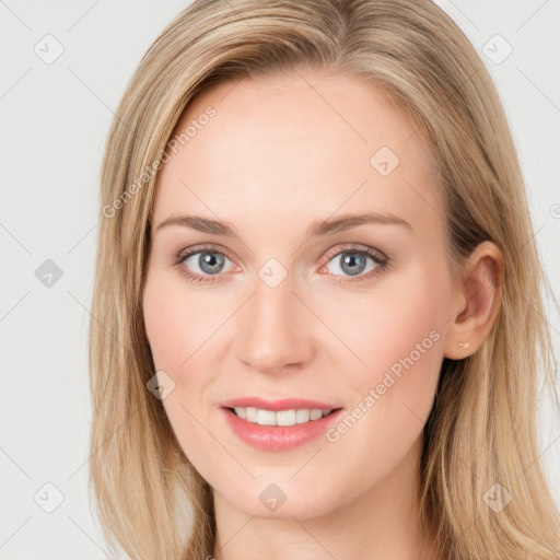 Joyful white young-adult female with long  brown hair and blue eyes