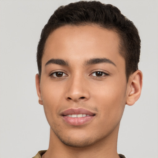 Joyful latino young-adult male with short  brown hair and brown eyes