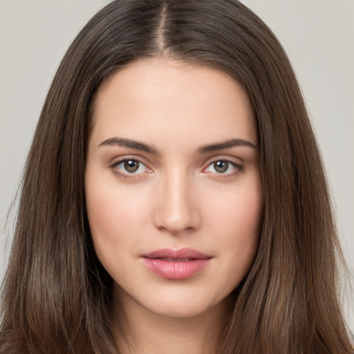 Neutral white young-adult female with long  brown hair and brown eyes