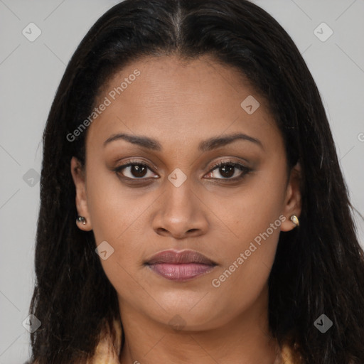 Joyful black young-adult female with long  brown hair and brown eyes