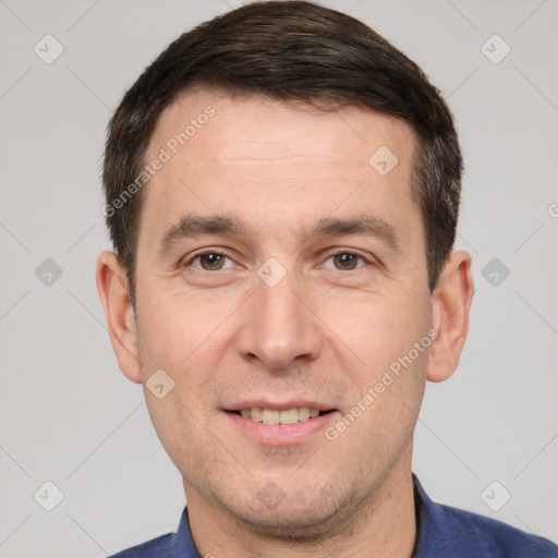 Joyful white adult male with short  brown hair and brown eyes