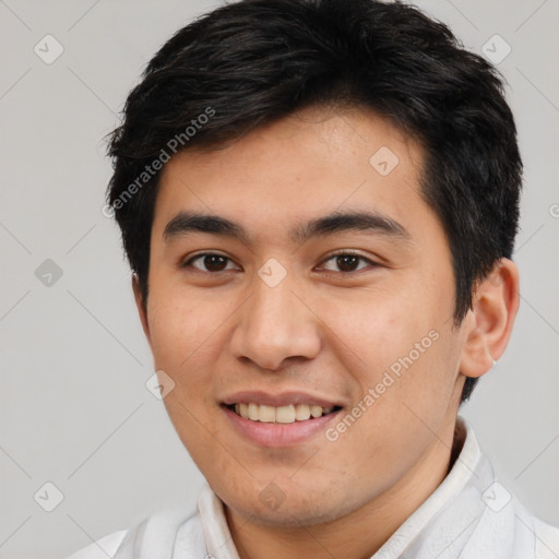 Joyful latino young-adult male with short  brown hair and brown eyes