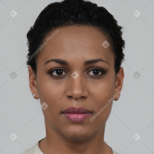 Joyful black young-adult female with short  black hair and brown eyes