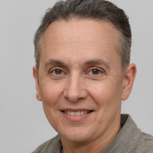 Joyful white middle-aged male with short  brown hair and brown eyes