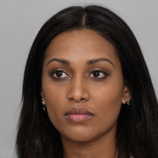 Neutral black young-adult female with long  black hair and brown eyes