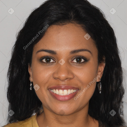 Joyful black young-adult female with long  black hair and brown eyes