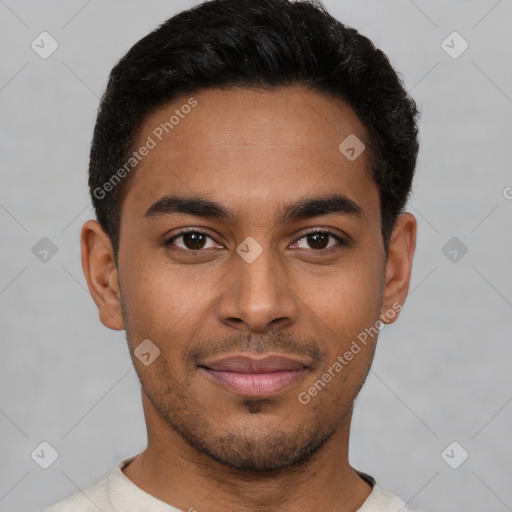 Joyful latino young-adult male with short  black hair and brown eyes