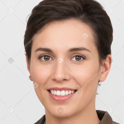 Joyful white young-adult female with short  brown hair and brown eyes