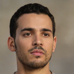 Neutral latino young-adult male with short  brown hair and brown eyes