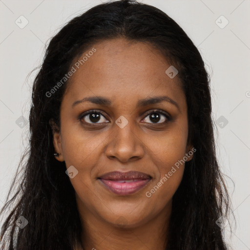 Joyful black young-adult female with long  brown hair and brown eyes