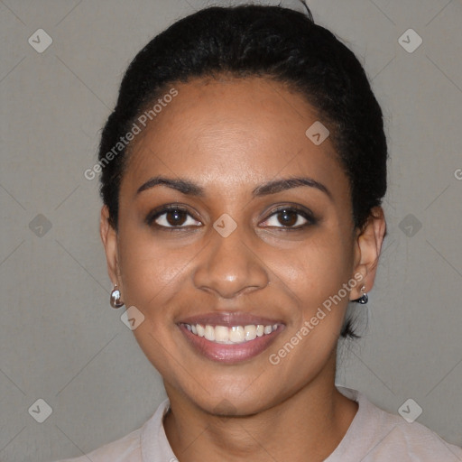 Joyful black young-adult female with short  black hair and brown eyes