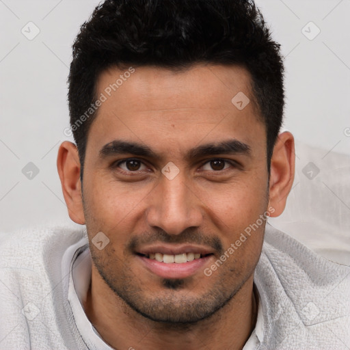 Joyful white young-adult male with short  black hair and brown eyes
