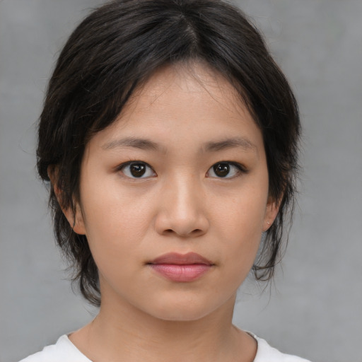 Neutral white young-adult female with medium  brown hair and brown eyes