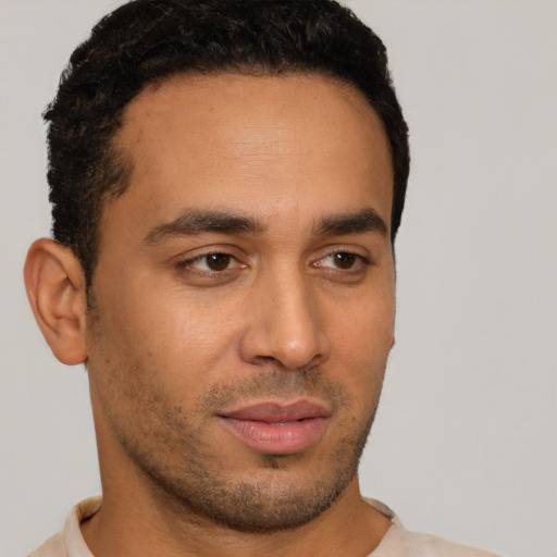 Neutral latino young-adult male with short  brown hair and brown eyes