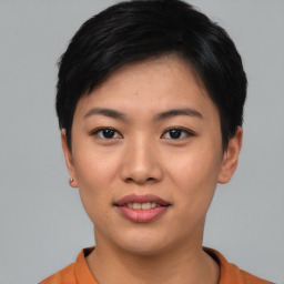 Joyful asian young-adult female with short  black hair and brown eyes