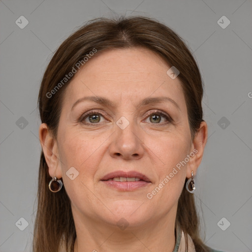 Joyful white adult female with medium  brown hair and grey eyes