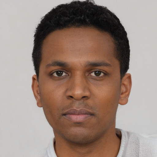 Neutral black young-adult male with short  black hair and brown eyes
