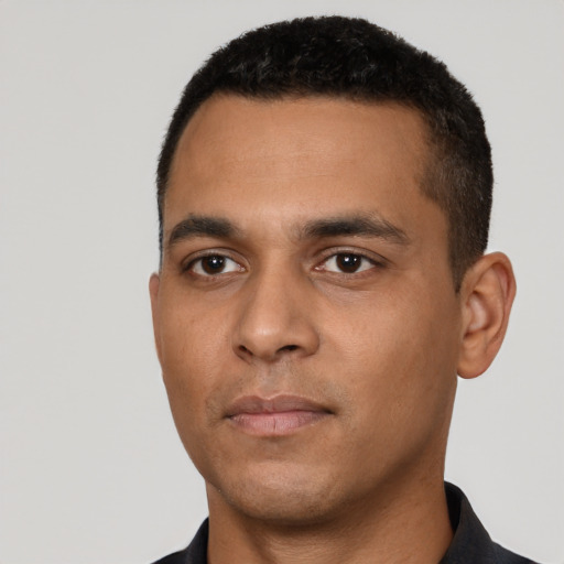 Neutral latino young-adult male with short  black hair and brown eyes