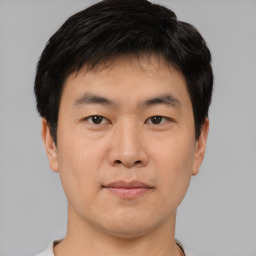 Neutral asian young-adult male with short  brown hair and brown eyes